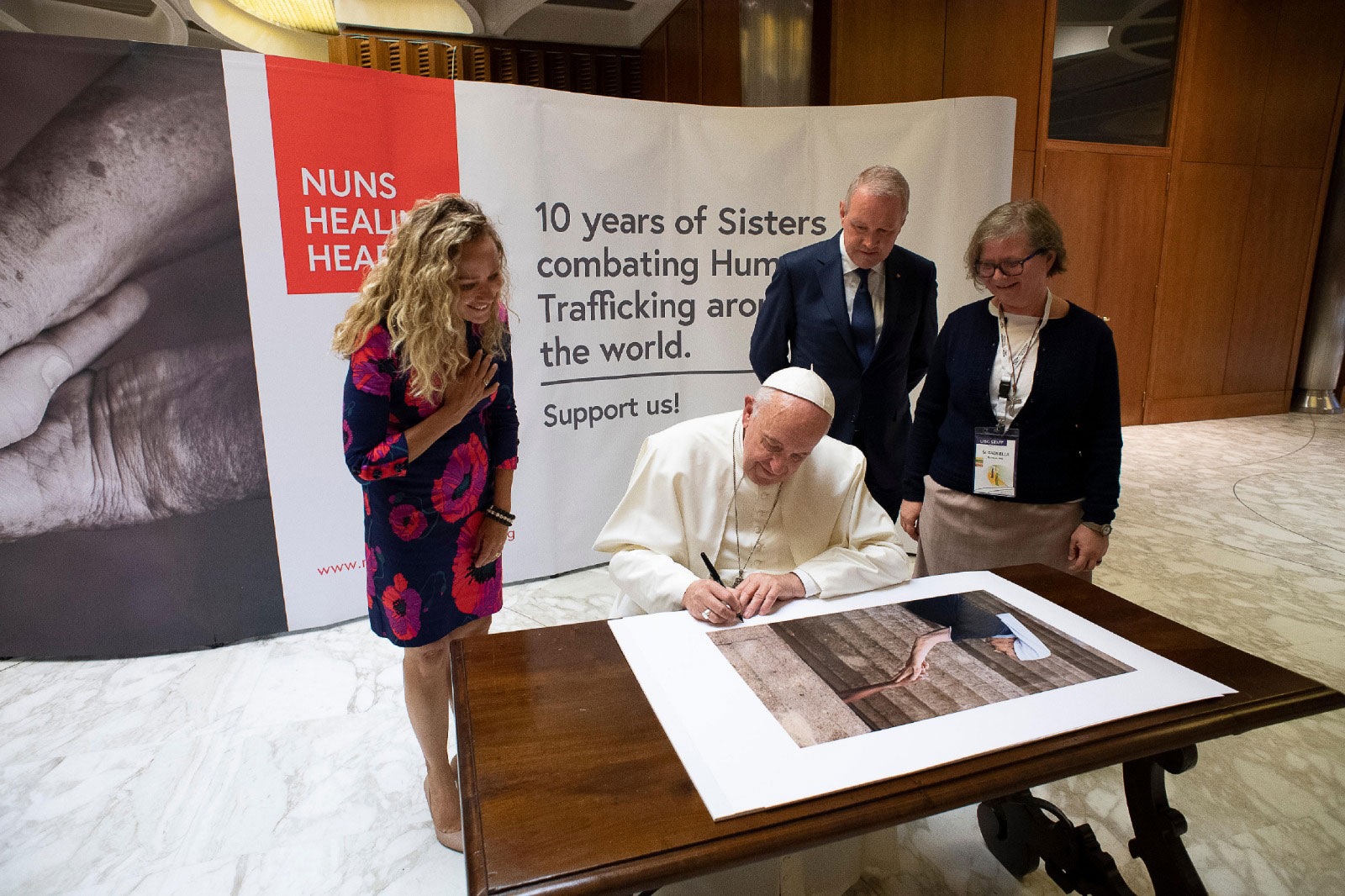 Pope Francis Signs Prints at the Vatican